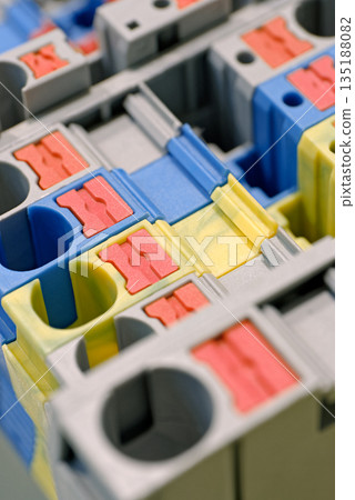 Variety of multi-colored plastic electrical installation terminals Variety of multi-colored plastic electrical installation terminals 135188082