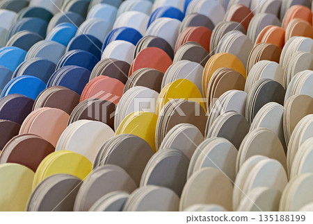 Multi-colored scales. Paper samples of paint in different colors. 135188199