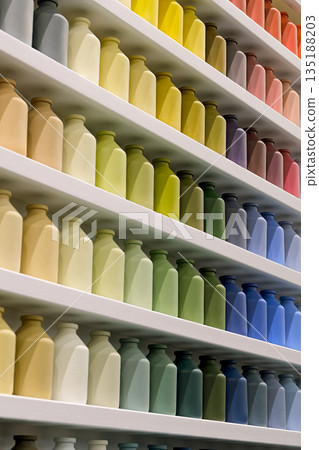 Many small jars of the same shape and size, different colors Many small jars of the same shape and size, different colors 135188203