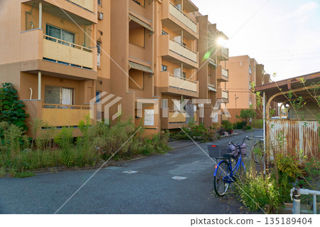 The exterior of an old housing complex in the suburbs. Housing conditions in Japan The exterior of an old housing complex in the suburbs. Housing conditions in Japan 135189404