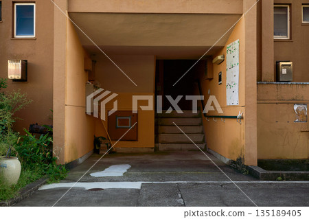 The exterior of an old housing complex in the suburbs. Housing conditions in Japan The exterior of an old housing complex in the suburbs. Housing conditions in Japan 135189405