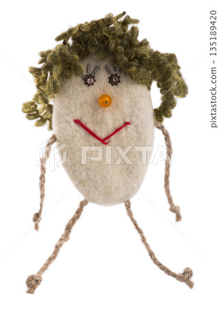 Suspension of felted wool in the form of a cheerful man on a white background Suspension of felted wool in the form of a cheerful man on a white background 135189420