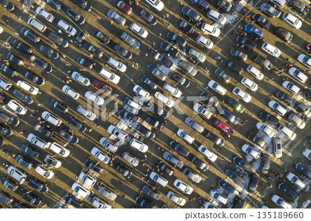 Aerial drone image of many cars parked on parking lot, top view. 135189660