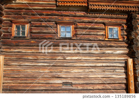 Old Russian Log House with Small Windows 135189856