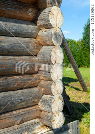 Corner of Wooden Log Cabin with Notched Joint, Close-Up Corner of Wooden Log Cabin with Notched Joint, Close-Up 135189868
