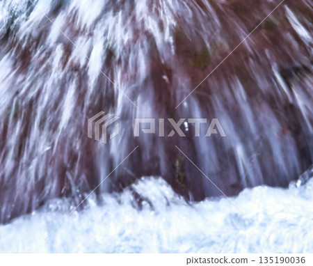 Blurred Rock in Flowing River Blurred Rock in Flowing River 135190036