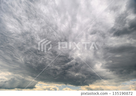 A Dramatic Overcast Sky Featuring Dynamic Cloud Patterns with Beautiful Textures and Colors A Dramatic Overcast Sky Featuring Dynamic Cloud Patterns with Beautiful Textures and Colors 135190872