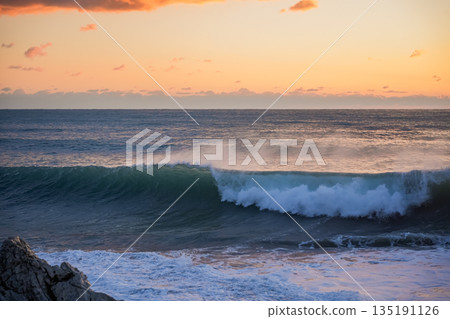 Sunset Wave Curling Over Winter Sea Sunset Wave Curling Over Winter Sea 135191126