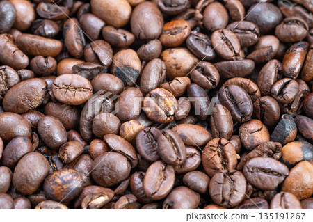 Large batch of java seeds transported through industrial roasting line, Massive quantity of roasted coffee beans flowing along production line in bustling factory Large batch of java seeds transported through industrial roasting line, Massive quantity of roasted coffee beans flowing along production line in bustling factory 135191267