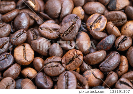 Closeup on coffee bean textures and details, Highresolution macro imagery highlighting surface imperfections and granular features of coffee beans for visual storytelling 135191307