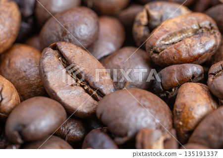 Magnified view highlighting cracks and oil patches on coffee beans, Highresolution inspection revealing surface flaws like cracks and oil deposits on coffee granules 135191337
