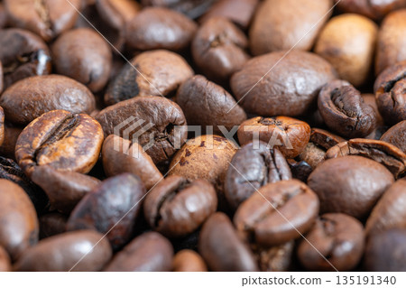 Coffee beans macro, Highcontrast detailed macro image of roasted coffee beans, Photograph capturing rich aroma and craftsmanship of small batch roasted coffee beans 135191340