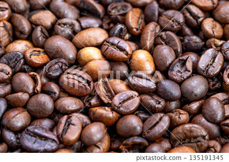 Varied roasted coffee bean display, Warm industrial atmosphere with roasted beans, Detailed shot of mixed roast coffee beans emphasizing craft and industrial ambiance Varied roasted coffee bean display, Warm industrial atmosphere with roasted beans, Detailed shot of mixed roast coffee beans emphasizing craft and industrial ambiance 135191345