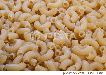 Uncooked spiral pasta provides nutrition, Plain raw macaroni offers necessary diet information, Unprocessed shaped pasta delivers key nutrients and energy sources Uncooked spiral pasta provides nutrition, Plain raw macaroni offers necessary diet information, Unprocessed shaped pasta delivers key nutrients and energy sources 135191384