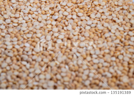 Pea groat textured background, Repetitive grain pattern suitable for industry, Visual representation of bulk pea groats emphasizing grains for industrial product imagery 135191389