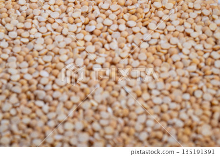 Highresolution image showcasing textured beige pea groats for culinary use, Detailed macro photograph capturing rich earthy tones and granular surface of pea groats Highresolution image showcasing textured beige pea groats for culinary use, Detailed macro photograph capturing rich earthy tones and granular surface of pea groats 135191391