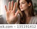 Woman Making Stop Gesture with Hand 135191412