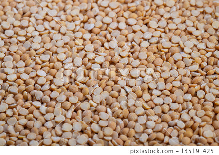 Yellow split peas close up for zero waste refill store concept, sustainable bulk buying, eco friendly packaging idea promoting green lifestyle and conscious shopping Yellow split peas close up for zero waste refill store concept, sustainable bulk buying, eco friendly packaging idea promoting green lifestyle and conscious shopping 135191425