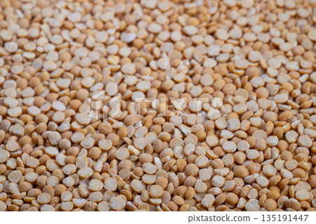Seamless beige split peas pattern fills entire frame, subtle tonal variation, matte texture, perfect for packaging backdrops, branding moodboards, and eco product design 135191447
