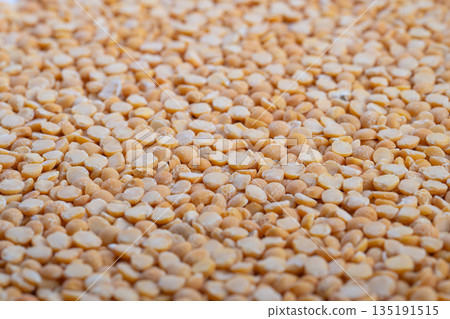 Industrial split peas closeup, processing line context with quality control narrative, bulk handling and packaging considerations, neutral lighting for product inspection theme Industrial split peas closeup, processing line context with quality control narrative, bulk handling and packaging considerations, neutral lighting for product inspection theme 135191515