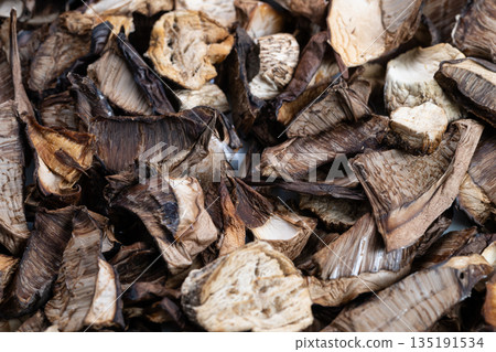 Dried mushrooms presentation, Pantry ingredient for culinary use, Thinly sliced mushrooms for recipe prep, Dried fungi arranged for professional kitchen display purposes Dried mushrooms presentation, Pantry ingredient for culinary use, Thinly sliced mushrooms for recipe prep, Dried fungi arranged for professional kitchen display purposes 135191534