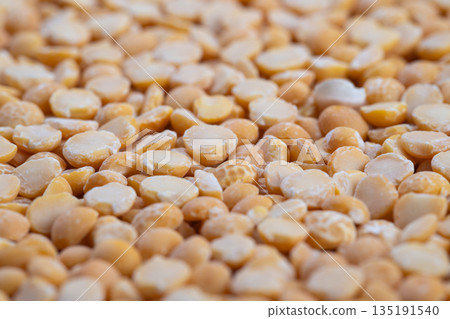 Closeup scattered yellow split peas bulk, styling for zerowaste refill stations and sustainable pantry shopping, texturerich detail suited for ecommerce and retail signage Closeup scattered yellow split peas bulk, styling for zerowaste refill stations and sustainable pantry shopping, texturerich detail suited for ecommerce and retail signage 135191540