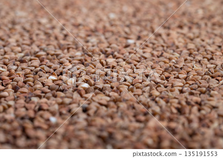 Closeup of nutritious buckwheat illustrating health benefits visually, Detailed image emphasizing wholesome qualities of buckwheat for health and nutrition branding Closeup of nutritious buckwheat illustrating health benefits visually, Detailed image emphasizing wholesome qualities of buckwheat for health and nutrition branding 135191553