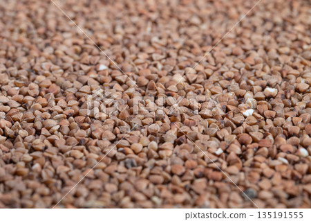 Storage of buckwheat grains indicating food industry packaging, Arrangement of buckwheat groats highlighting volume and quality for commercial food distribution Storage of buckwheat grains indicating food industry packaging, Arrangement of buckwheat groats highlighting volume and quality for commercial food distribution 135191555
