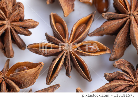 Macroscopic examination highlighting natural patterns on star anise pods, Photographic analysis emphasizing intricate details and textures of star anise seed chambers Macroscopic examination highlighting natural patterns on star anise pods, Photographic analysis emphasizing intricate details and textures of star anise seed chambers 135191573