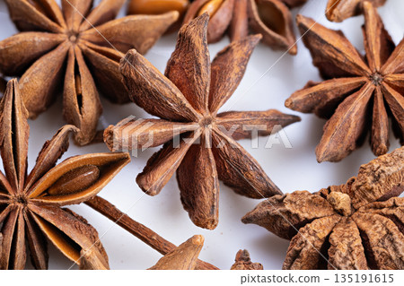 Star anise infusion, Herbal tea with aromatic spice, Botanical seeds prepared for herbal infusion, Medicinal aroma from dried star anise in wellness kitchen setup Star anise infusion, Herbal tea with aromatic spice, Botanical seeds prepared for herbal infusion, Medicinal aroma from dried star anise in wellness kitchen setup 135191615