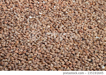 Buckwheat pattern backdrop, Background with evenly spread buckwheat grains for mockup use, Textured flatlay of buckwheat groats showcasing consistent pattern in neutral shades Buckwheat pattern backdrop, Background with evenly spread buckwheat grains for mockup use, Textured flatlay of buckwheat groats showcasing consistent pattern in neutral shades 135191645