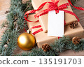 Christmas rectangle gift tag mockup with present box Christmas rectangle gift tag mockup with present box 135191703