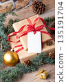 Christmas rectangle gift tag mockup with present box Christmas rectangle gift tag mockup with present box 135191704
