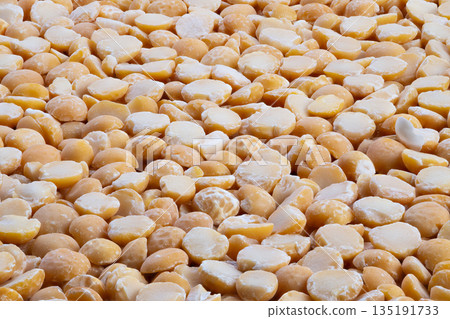 Supply chain visualization of yellow split peas in bulk, Manufacturing and logistics scenes featuring bulk yellow split peas with powder coating and uniform shape 135191733