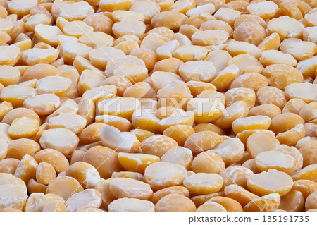 Rustic yellow peas prepared, Organic yellow split peas displayed on rustic wooden surface, Fresh split peas with coarse grains on wooden table for cooking or blogging Rustic yellow peas prepared, Organic yellow split peas displayed on rustic wooden surface, Fresh split peas with coarse grains on wooden table for cooking or blogging 135191735