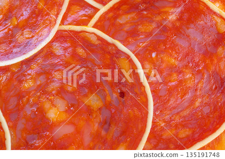 Salami strip texture, Repetitive circular salami design, Decorative salami slices with detailed borders, Artistic portrayal of sliced salami with textured surface and borders 135191748