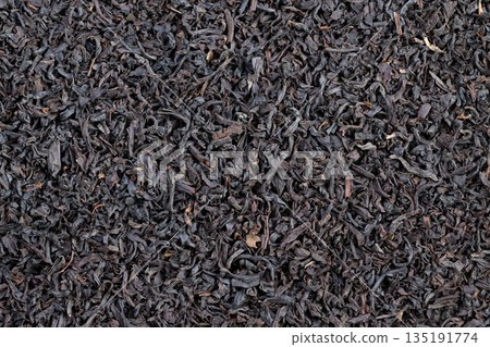 Tea tasting cupping sample of Ceylon black tea leaves shown dry, sensory notes visible through leaf structure with focus on palate, finish, clarity, and aroma cues 135191774