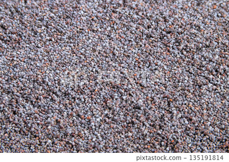 Even poppy seed surface for baking and recipe photography, offering soft neutral tones and subtle highlights, ideal for flatlay shots, product mockups, and clean editorial layouts 135191814