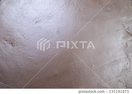 Sandy shore closeup, Surface detail of beach sand, Close view of damp sandy terrain surface, Examination of moist beach earth with glimmers and ripples observed Sandy shore closeup, Surface detail of beach sand, Close view of damp sandy terrain surface, Examination of moist beach earth with glimmers and ripples observed 135191873