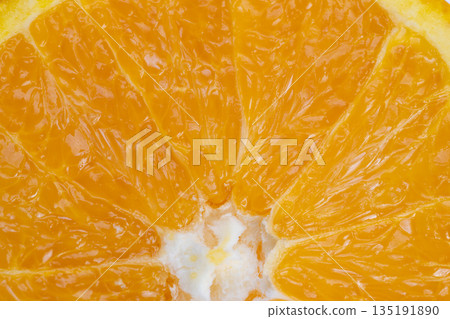 Sunlit orange slice showing glistening juice and vibrant flesh, warm summer mood with crisp contrast, ideal for beverage and lifestyle campaigns promoting refreshment and energy Sunlit orange slice showing glistening juice and vibrant flesh, warm summer mood with crisp contrast, ideal for beverage and lifestyle campaigns promoting refreshment and energy 135191890