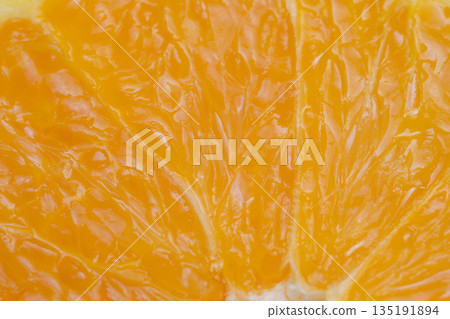 Fruit textured background, Orange pulp with glossy highlights, Repeating pulp motifs on warm tone surface, Design backdrop featuring glossy orange pulp texture with warm colors 135191894