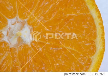 Vibrant fruit interior, Crosssection of citrus revealing nutrients and juicy segments, Close proximity shot highlighting dense juice cells and healthful properties of orange Vibrant fruit interior, Crosssection of citrus revealing nutrients and juicy segments, Close proximity shot highlighting dense juice cells and healthful properties of orange 135191928