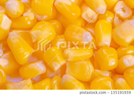 Vivid yellow kernels gleaming brightly under luminous light conditions, Closeup of shiny and juicy yellow corn kernels glowing with vibrant brightness across scene Vivid yellow kernels gleaming brightly under luminous light conditions, Closeup of shiny and juicy yellow corn kernels glowing with vibrant brightness across scene 135191939