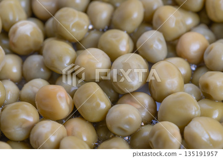 Closeup of canned peas for nutritional analysis presentation, Detailed display of canned peas illustrating dietary benefits through closeup nutritional evaluation illustrations 135191957