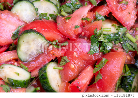 Fresh vegetable salad, Closeup image showcasing vibrant fresh garden vegetables, Highresolution macro view revealing crisp textures of garden vegetables with oil and herbs 135191975