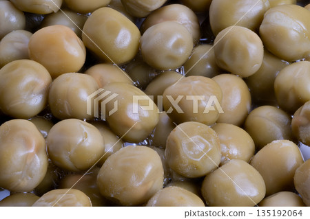 Glistening canned peas closeup, Close detail of oilcoated canned peas with reflections, Highly detailed macro shot of shiny canned peas with moist surface and highlights Glistening canned peas closeup, Close detail of oilcoated canned peas with reflections, Highly detailed macro shot of shiny canned peas with moist surface and highlights 135192064
