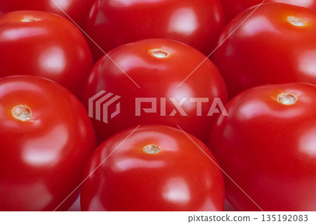 Closeup of ripe cherry tomatoes, Focus on texture and vivid coloration, Chef chooses ripe cherry tomatoes emphasizing surface texture and vibrant colors for culinary use 135192083