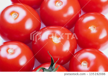 Ripe cherry tomatoes grouped for salad, smooth skin, reflective highlights, studio white backdrop, tight framing, appetizing texture and color, clean culinary styling Ripe cherry tomatoes grouped for salad, smooth skin, reflective highlights, studio white backdrop, tight framing, appetizing texture and color, clean culinary styling 135192086