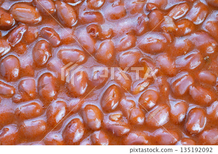 Smoky beans in rustic setting, Closeup of earthy beans with smoky outdoor environment, Rustic style red beans with smoky outdoor ambiance captured in detailed closeup Smoky beans in rustic setting, Closeup of earthy beans with smoky outdoor environment, Rustic style red beans with smoky outdoor ambiance captured in detailed closeup 135192092