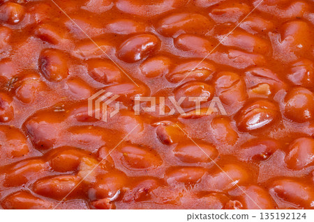 Rich protein meal presentation, Prepared red beans with thick sauce in kitchen setting, Detailed view of nutritious vegan beans with savory sauce ready to serve Rich protein meal presentation, Prepared red beans with thick sauce in kitchen setting, Detailed view of nutritious vegan beans with savory sauce ready to serve 135192124